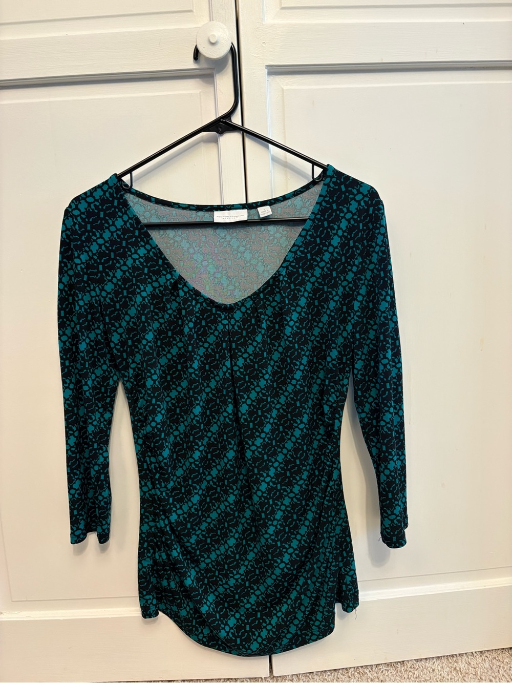 New York & Company woman’s 3/4-sleeve ruched green patterned top